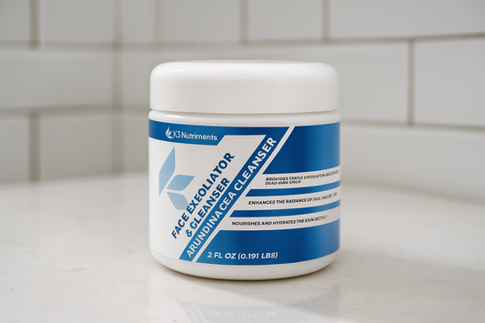 A close-up image of the K3 Nutriments Face Exfoliator & Cleanser jar placed on a clean white bathroom countertop, with a modern white subway tile wall in the background.